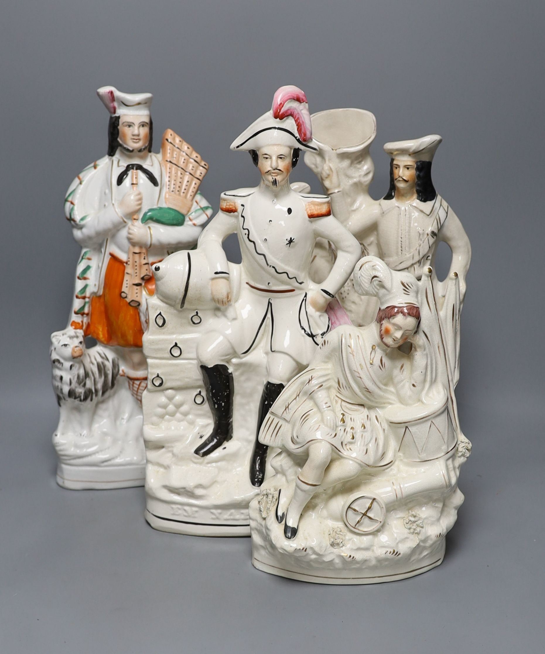Four 19th century Staffordshire pottery groups - 40cm tall